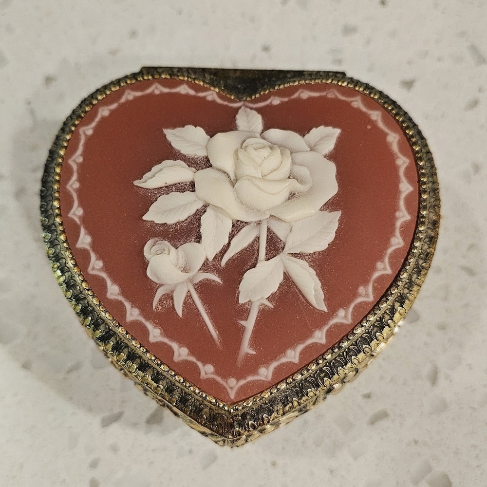 Heart-Shaped Cameo Jewelry Box with White Rose on Coral Background